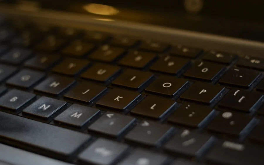 Hands typing on a keyboard